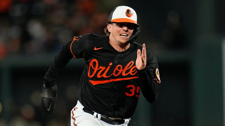 Baltimore Orioles designated hitter Adley Rutschman runs the bases on...