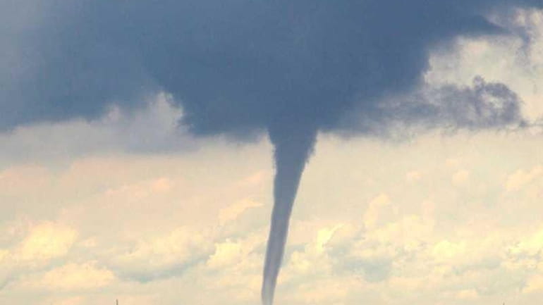 A water spout can be seen from Mount Sinai Harbor...