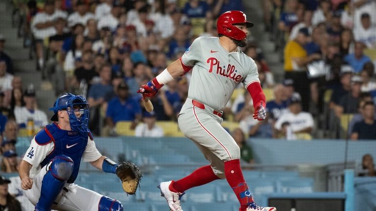 Philadelphia Phillies' Kyle Schwarber hits an RBI single during the...