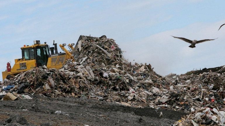 A plow is used to move waste at the Brookhaven...