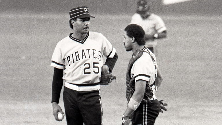 Pittsburgh Pirates rookie pitcher José DeLeón, left, is consoled by...