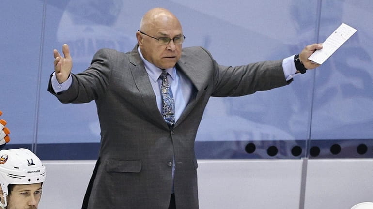 Barry Trotz of theIslanders argues a first period call during...