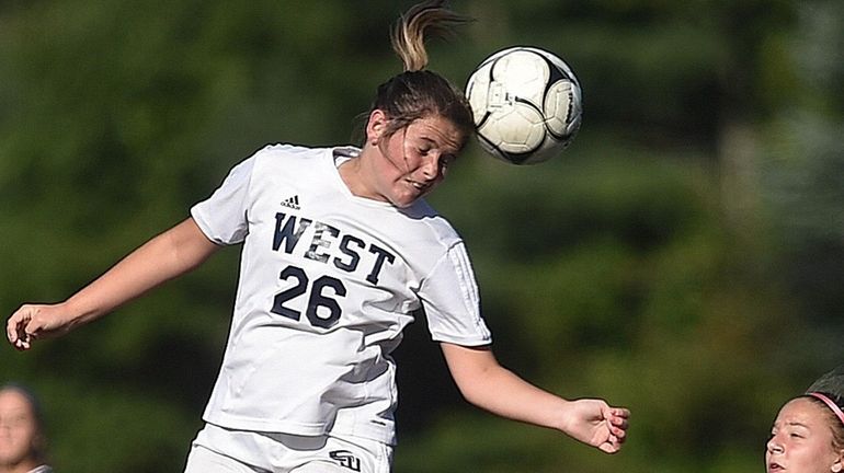 Jillian Meaney of Smithtown West makes a header during a...