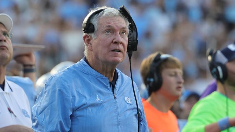 North Carolina head coach Mack Brown watches a replay during...