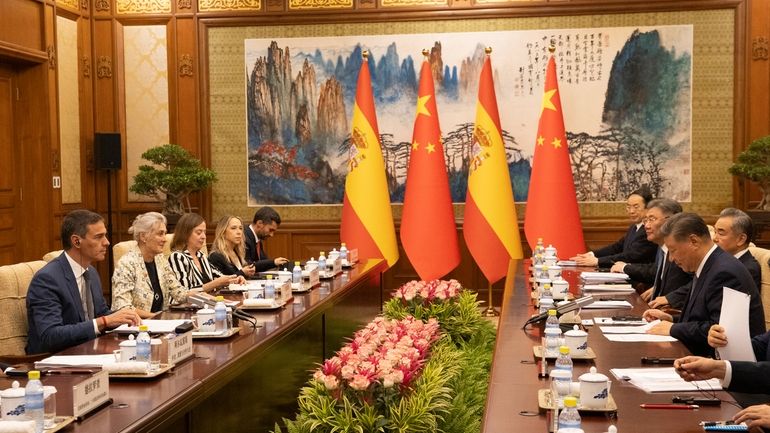 Spain's Prime Minister Pedro Sanchez, left, and China's President Xi...