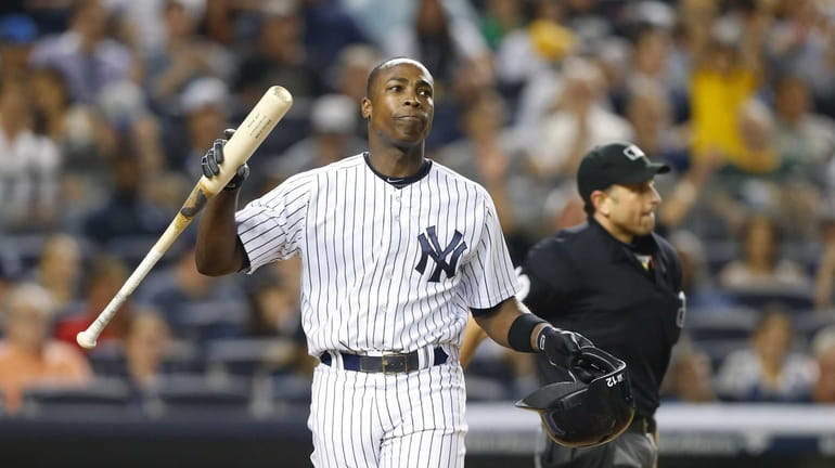 Alfonso Soriano of the Yankees reacts after striking out to...