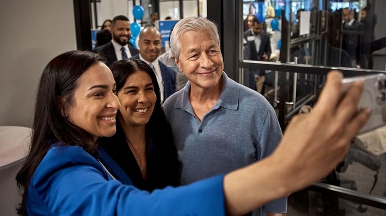 Jamie Dimon, CEO and chairman of JPMorgan Chase, center right,...