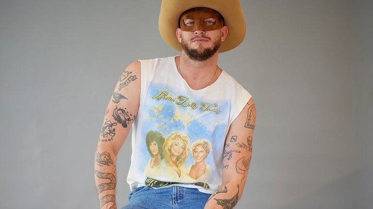 Country music artist Orville Peck poses for portraits on Wednesday,...