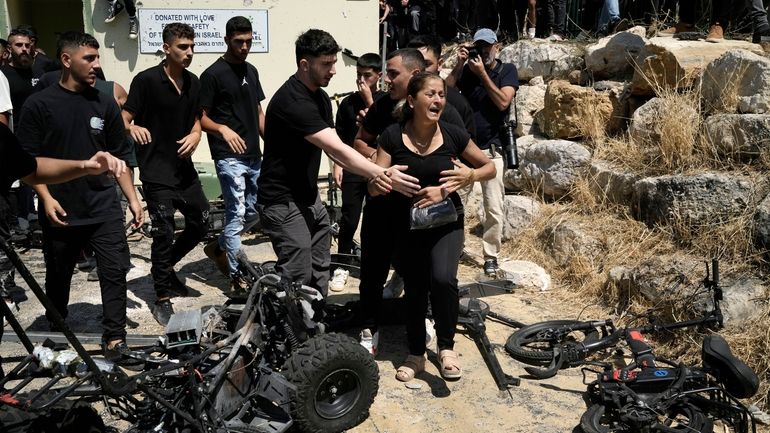 A woman from the Druze minority is overcome by emotion...