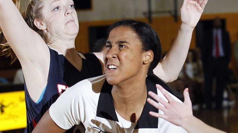 St. Anthony's Symone Kelly (24) drives hard in the paint...