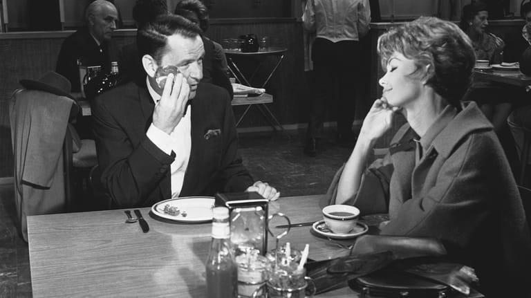 Frank Sinatra, left, appears with Barbara Rush in a scene...