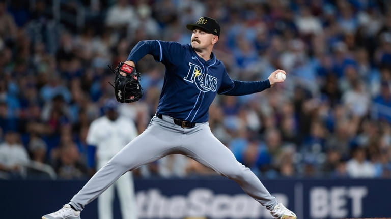 Tampa Bay Rays starting pitcher Tyler Alexander throws to a...