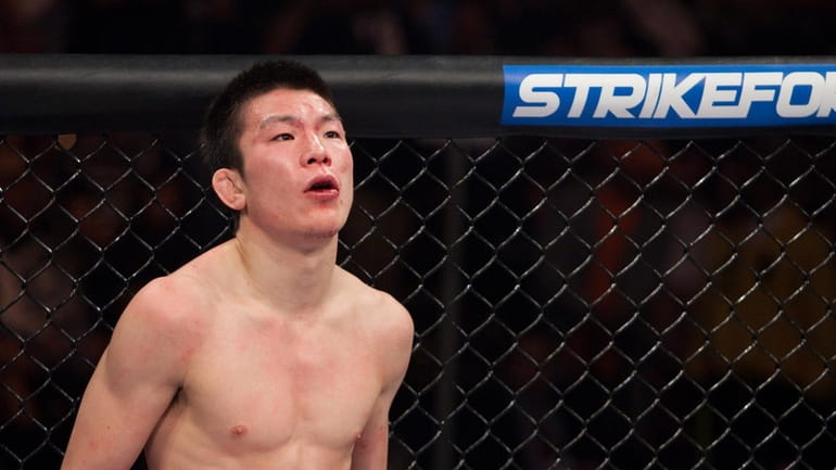 Shinya Aoki wonders what's going on as he lost a...