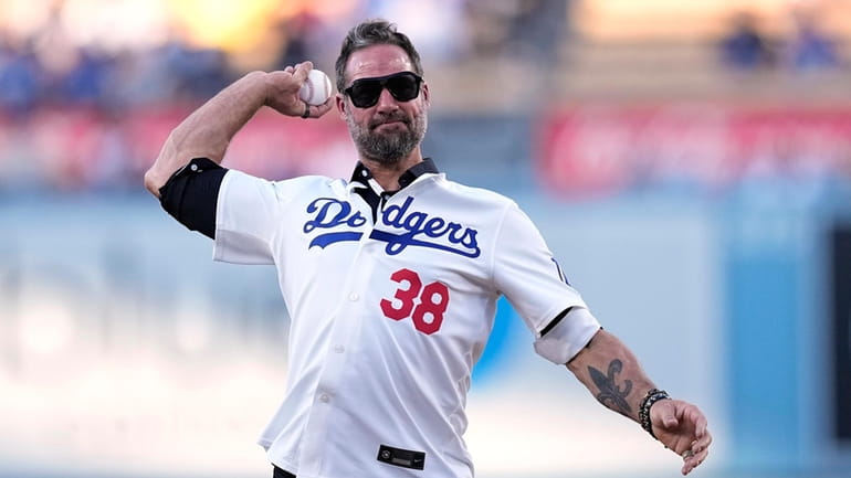 Former Los Angeles Dodgers reliever Eric Gagne throws out the...