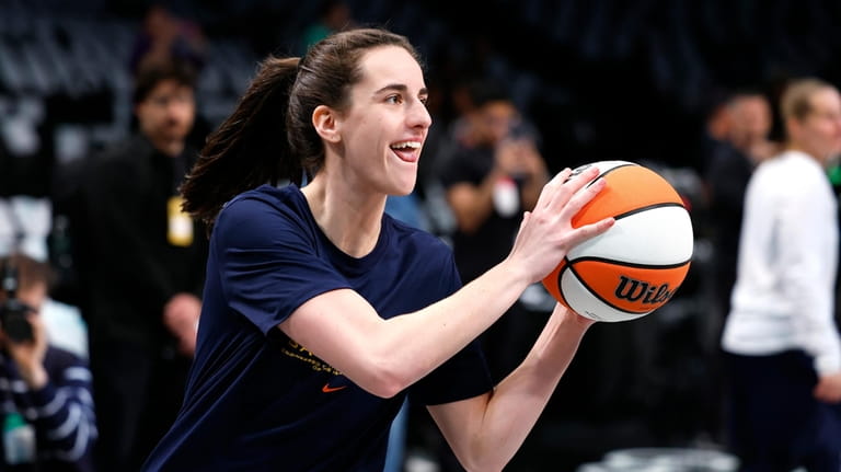 Indiana Fever guard Caitlin Clark warms up before an WNBA...