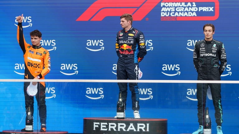 Winner Red Bull Racing driver Max Verstappen, center, of the...