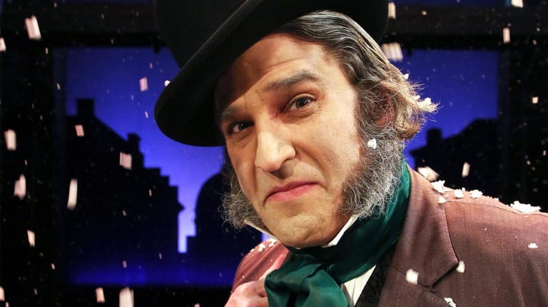 Jeffrey Sanzel plays Ebenezer Scrooge in "A Christmas Carol" at...