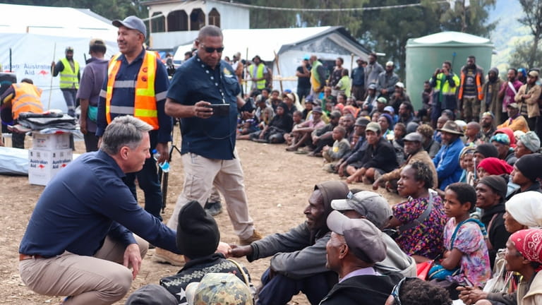 In this photo released by IOM- PNG, Australia's Deputy Prime...