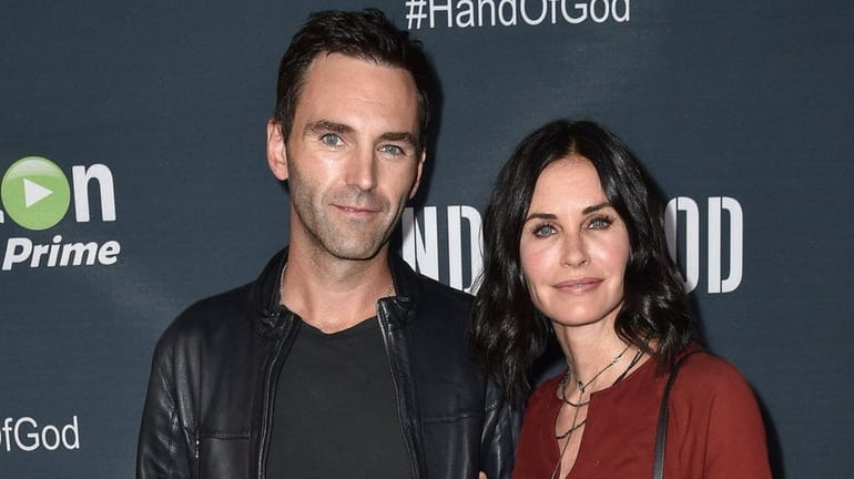 Johnny McDaid, left, and Courteney Cox arrive at the premiere...