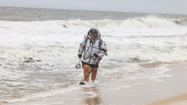 Some rough surf Thursday at the beach at Smith Point County...