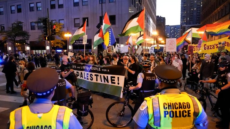 Protesters march passed a police line prior to the start...