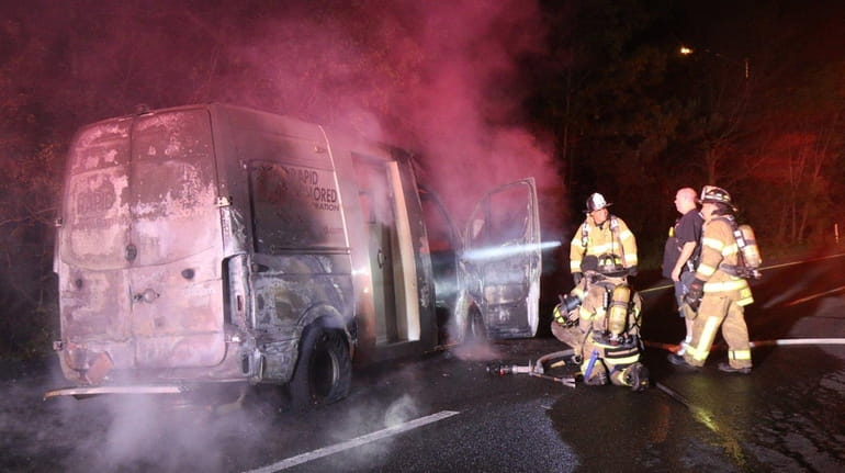 An armored truck caught fire on the service road of...