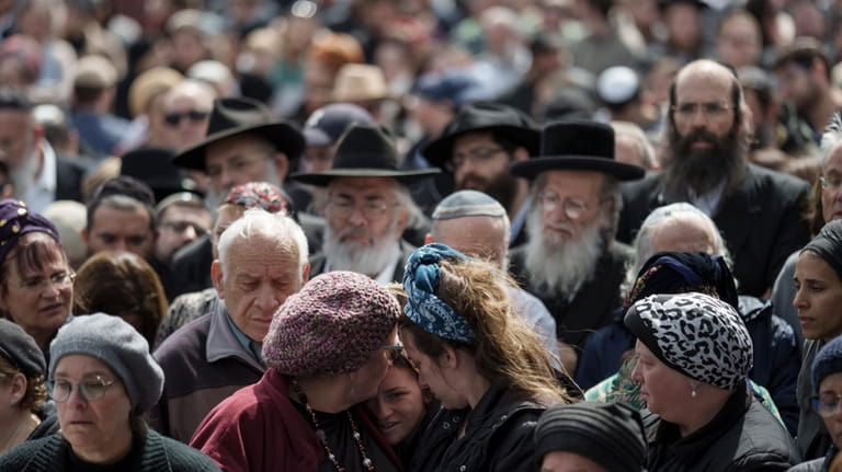 Family and friends of Yitzhak Zeiger mourn during his funeral...