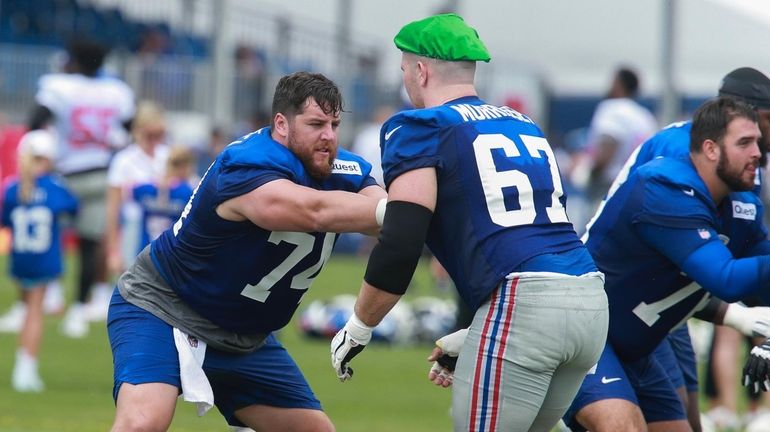 Giants guard Greg Van Roten does a drill during training...