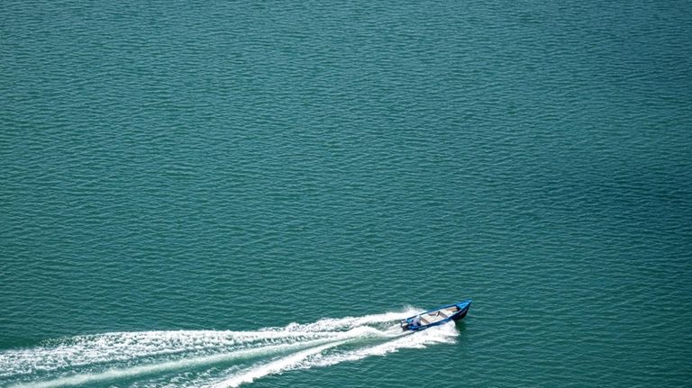 A fisherman zips across Guanica Bay in Guanica, Puerto Rico.