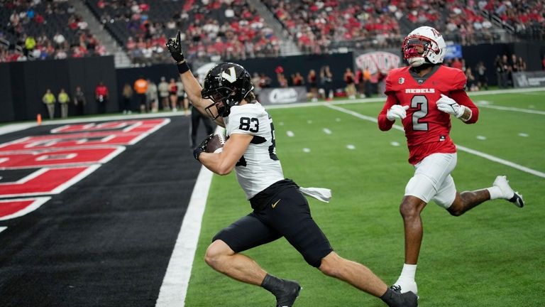 Vanderbilt wide receiver London Humphreys (83) scores a touchdown past...