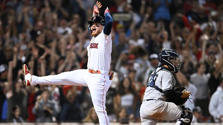 Alex Verdugo #99 of the Boston Red Sox celebrates after...