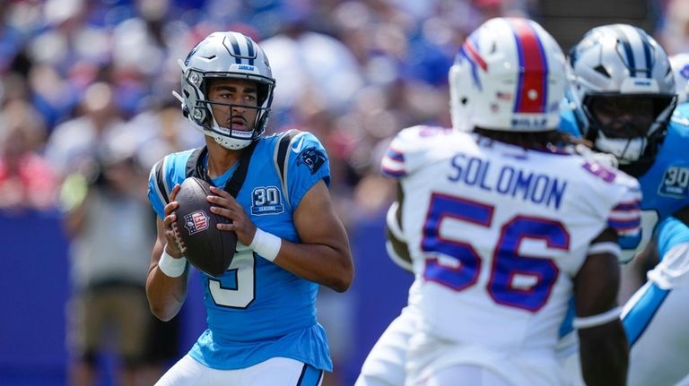 Carolina Panthers quarterback Bryce Young (9) drops back to pass...