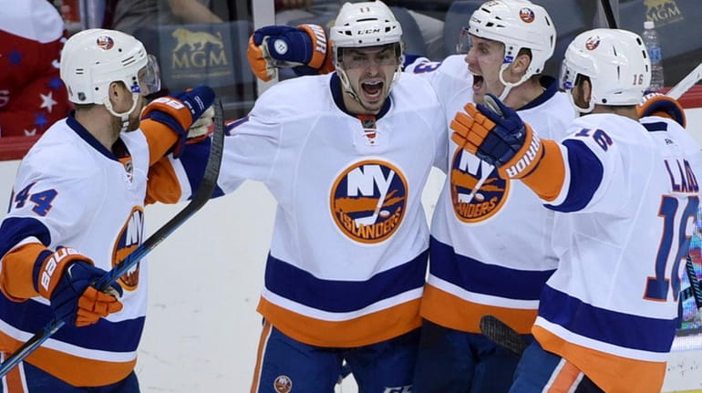 New York Islanders' center Shane Prince (11) celebrates his goal...