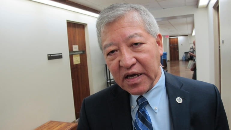 Honolulu Prosecuting Attorney Keith Kaneshiro talks to The Associated Press...