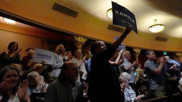 Supporters watch as Vice President Kamala Harris delivers remarks at...