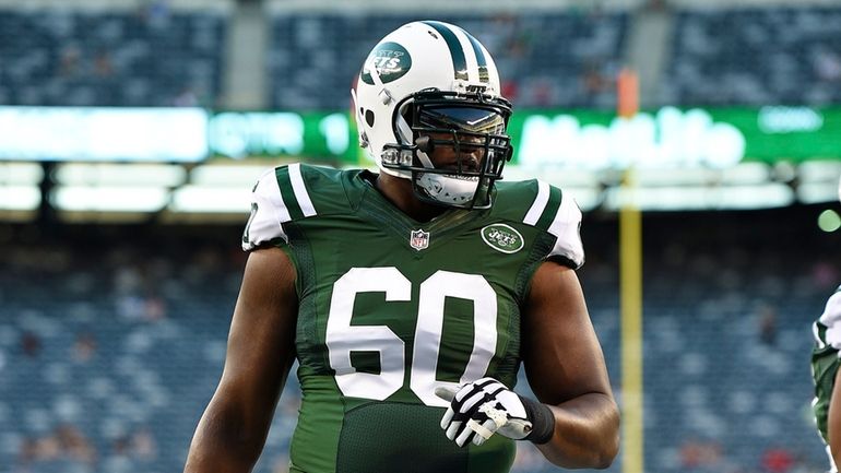 Jets tackle D'Brickashaw Ferguson (warms up prior to an NFL...