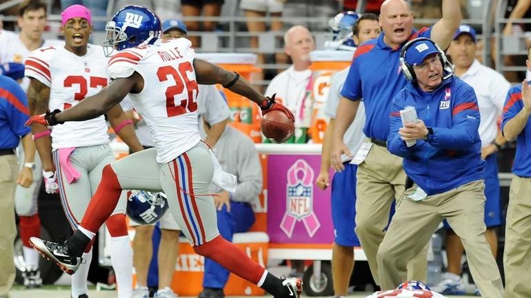 Head Coach Tom Coughlin of the New York Giants cheers...