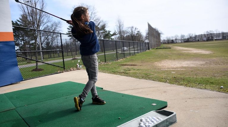 Pratice your golf swing at the driving range at Cantiague Park...