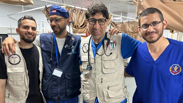 Dr. Ammar Ghanem, an ICU specialist from Detroit volunteering with...