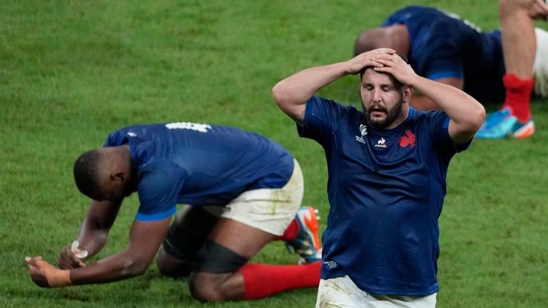 France's Dorian Aldegheri, right, reacts after the Rugby World Cup...