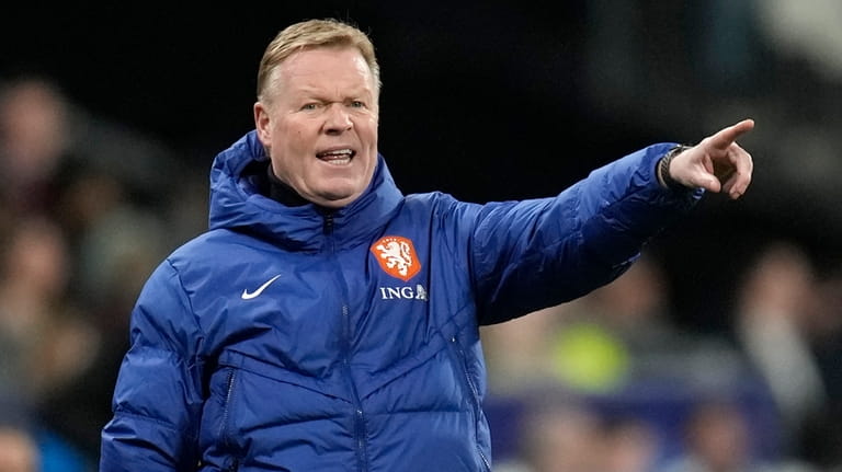 Netherlands' head coach Ronald Koeman gives instructions from the side...