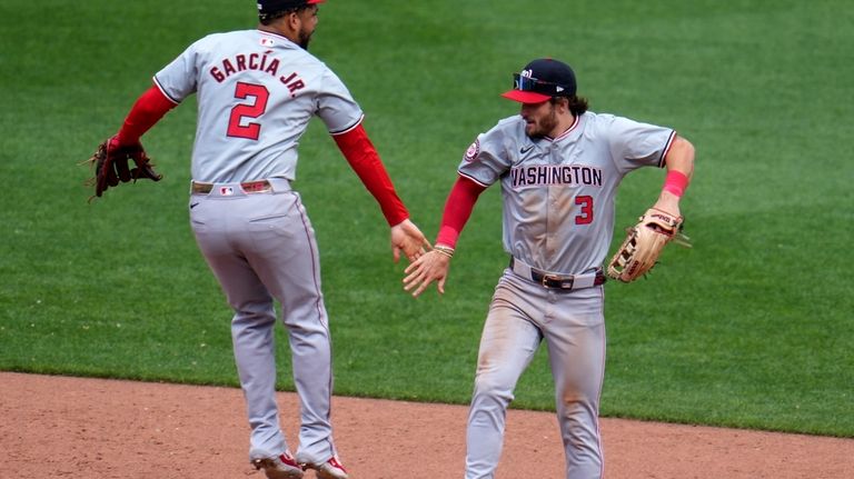 Washington Nationals' Dylan Crews (3) celebrates with Luis García Jr....