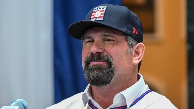 Baseball Hall of Fame inductee Todd Helton talks with reporters during...