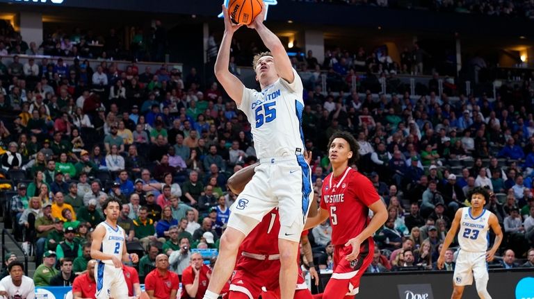 Creighton guard Trey Alexander, right, looks to pass the ball as North  Carolina State guard Jack Clark defends in the first half of a first-round  college basketball game in the men's NCAA