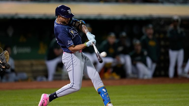 Tampa Bay Rays' Jose Siri hits a solo home run...