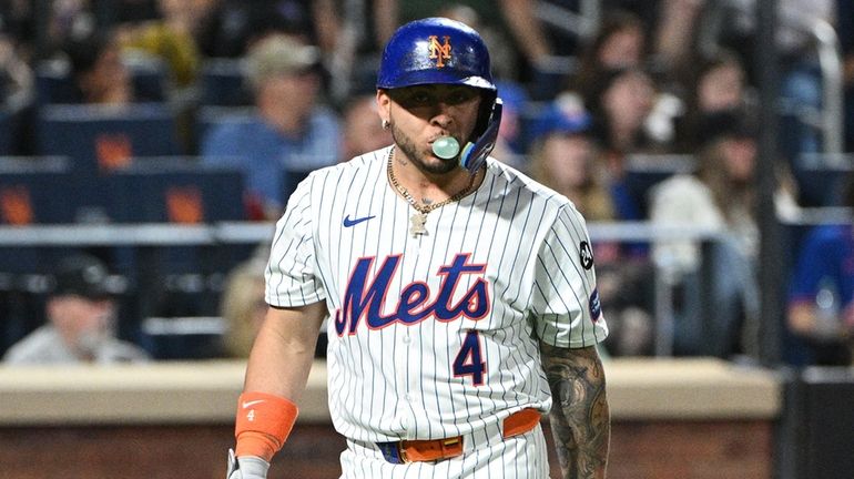 Mets catcher Francisco Alvarez returns to the dugout after striking...