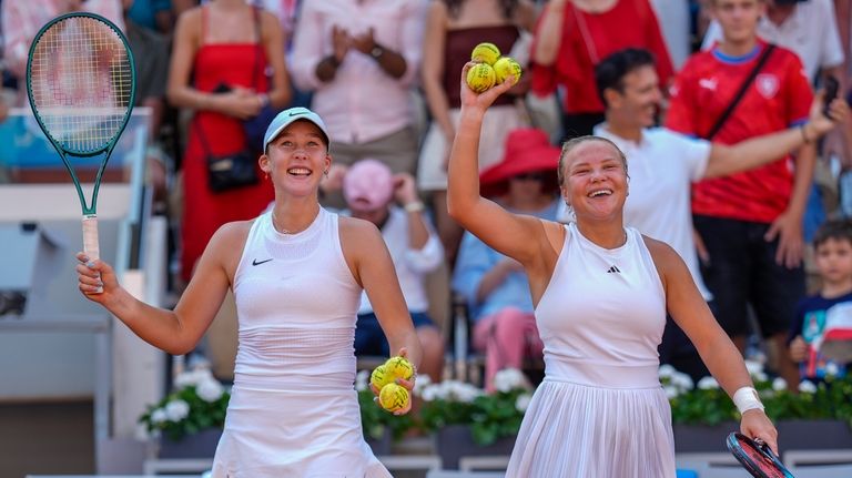 Mirra Andreeva and Diana Shnaider of Individual Neutral Athlete celebrate...