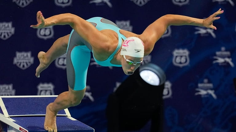 Abbey Weitzeil starts on her way to winning the 50-meter...