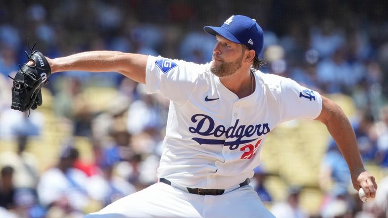 Los Angeles Dodgers starting pitcher Clayton Kershaw (22) throws a...