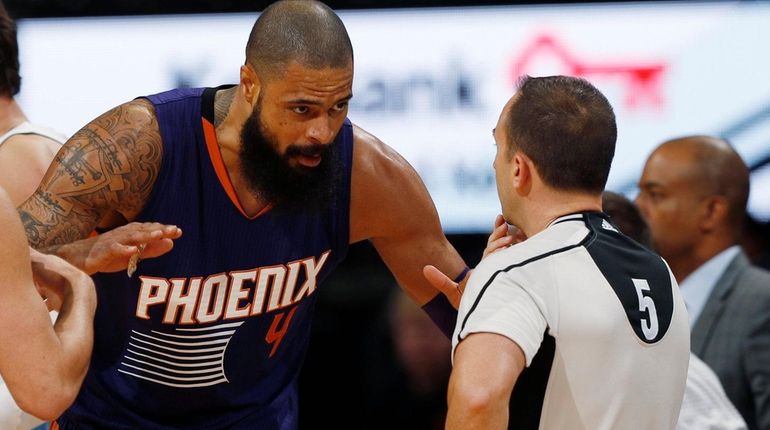 Phoenix Suns center Tyson Chandler, arguing with referee Kane Fitzgerald...